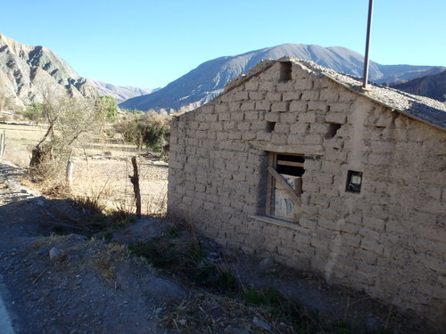 Adobe structure on a roadside farm.